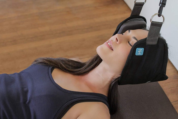 Woman using Neck Hammock.